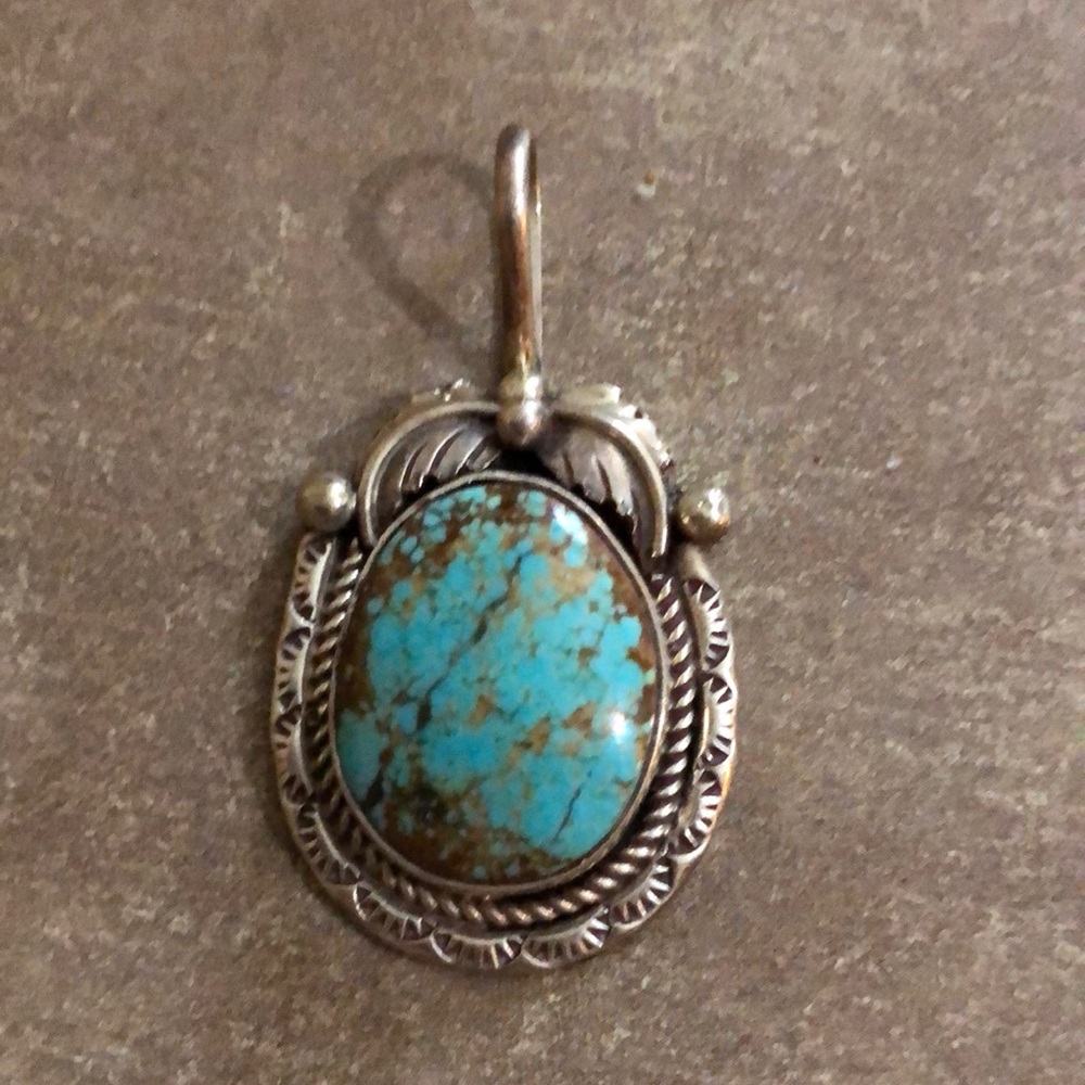 A T sterling silver Number 8 turquoise sterling silver pendant. Brand new
